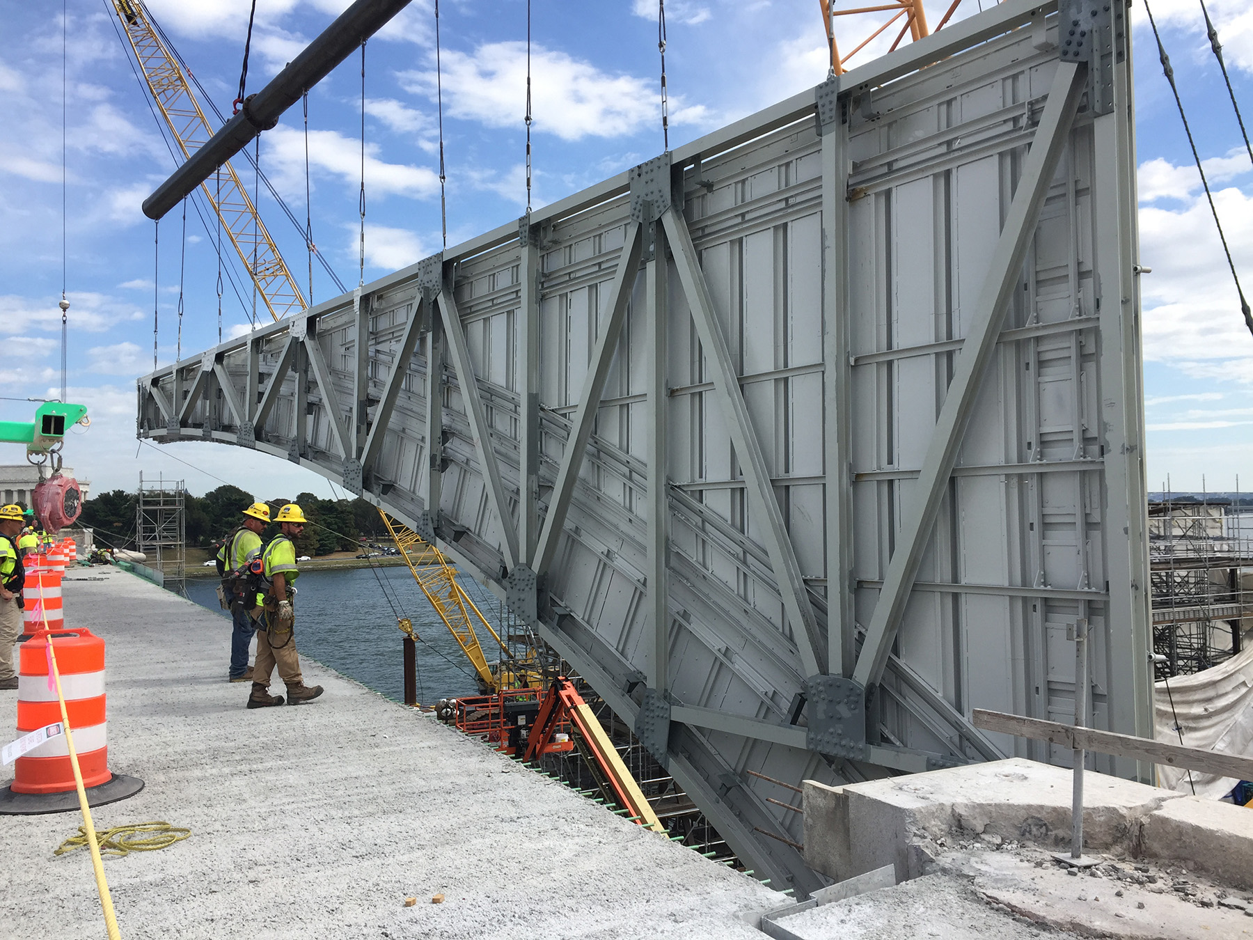 steel framed portion of a bridge being fitted in place