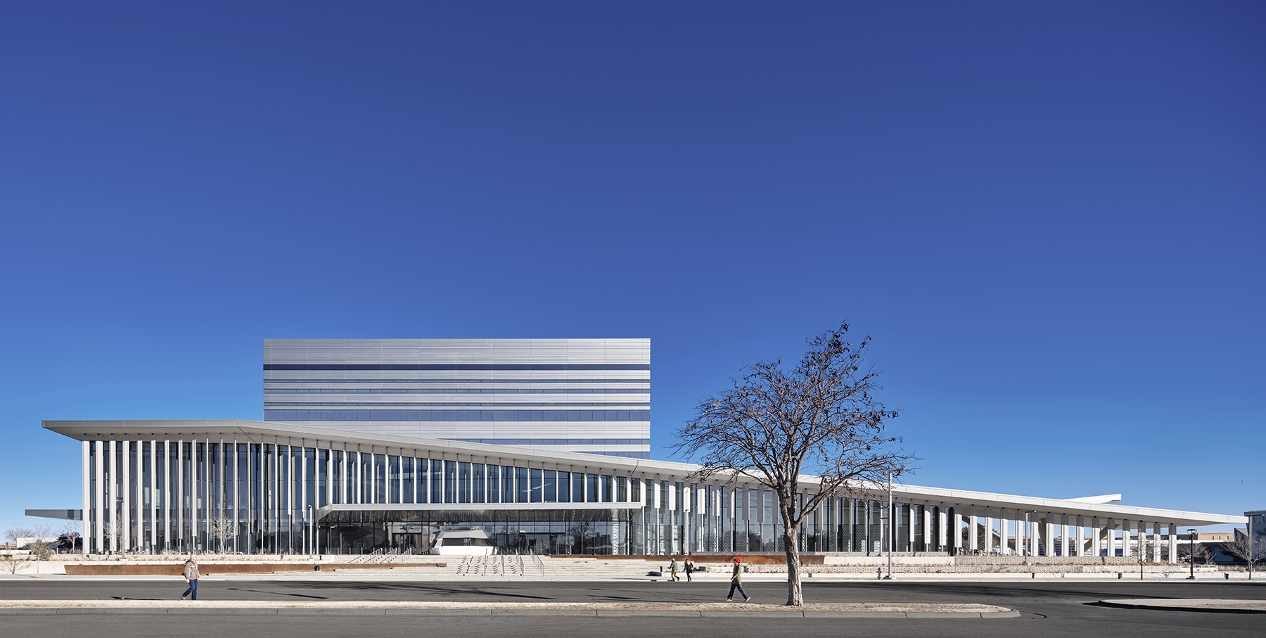 linear building with vertical stripes on its façade. it is supposed to resemble a bird’s wing