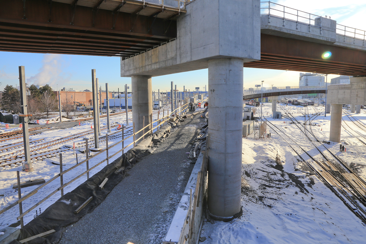 A close-up feature of what is show in the image above this one, the eastbound Union Square Branch viaduct, shown here under construction, narrowly threads between pier columns of the main Lechmere Viaduct. (Image courtesy of GLX Constructors) 