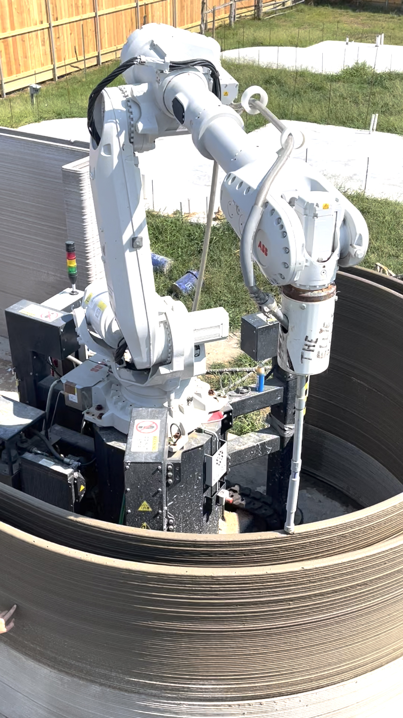 The 3D printer features a robot arm on a crawler system with a circular printing envelope. (Photograph courtesy of Hive3D)