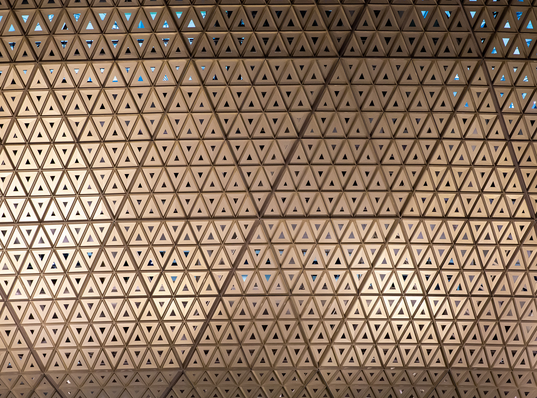 The photograph shows a detail of a triangular-shaped decorative design used on the Lusail Stadium. 