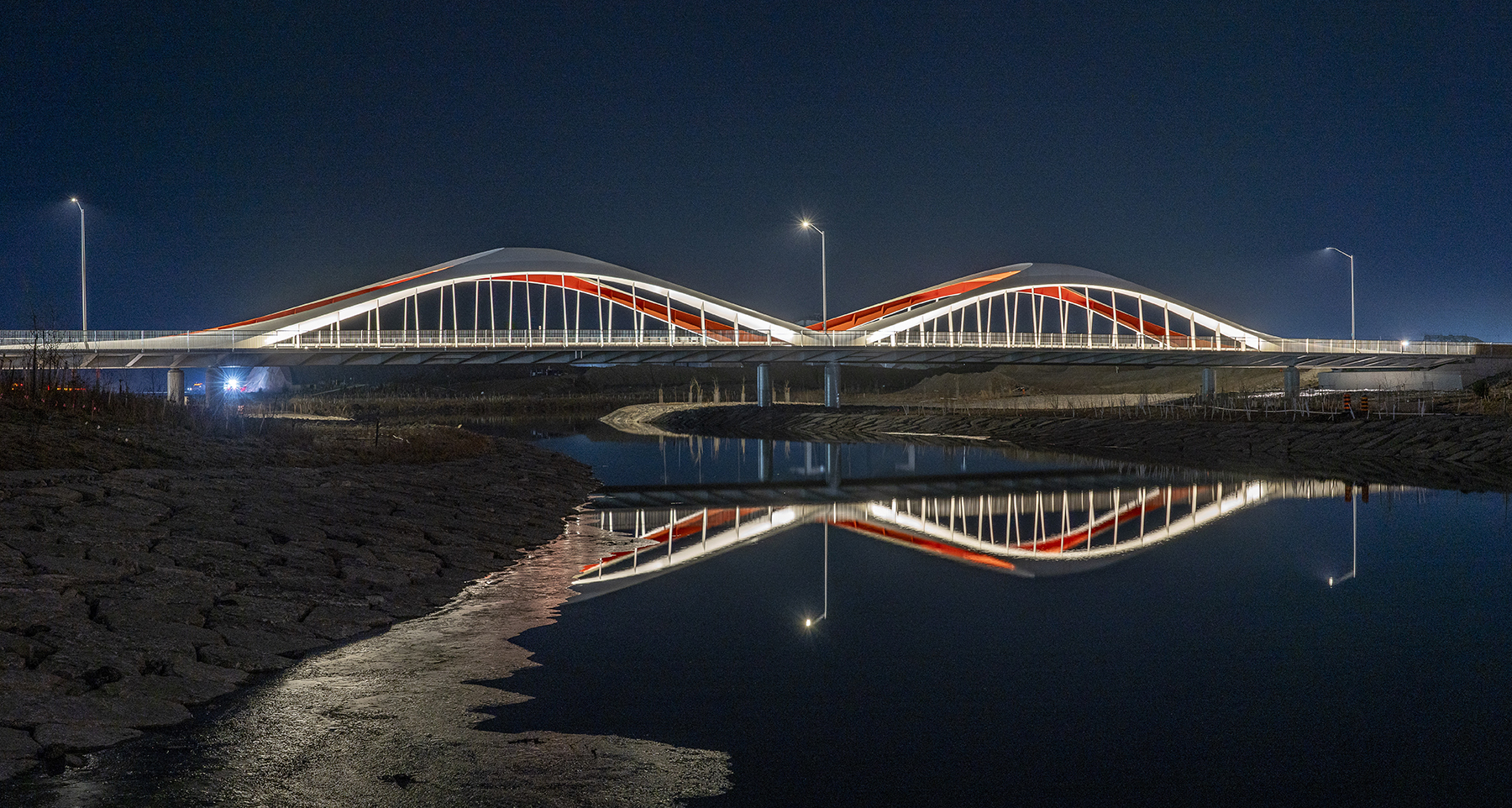 image of bridge over water at nighttime