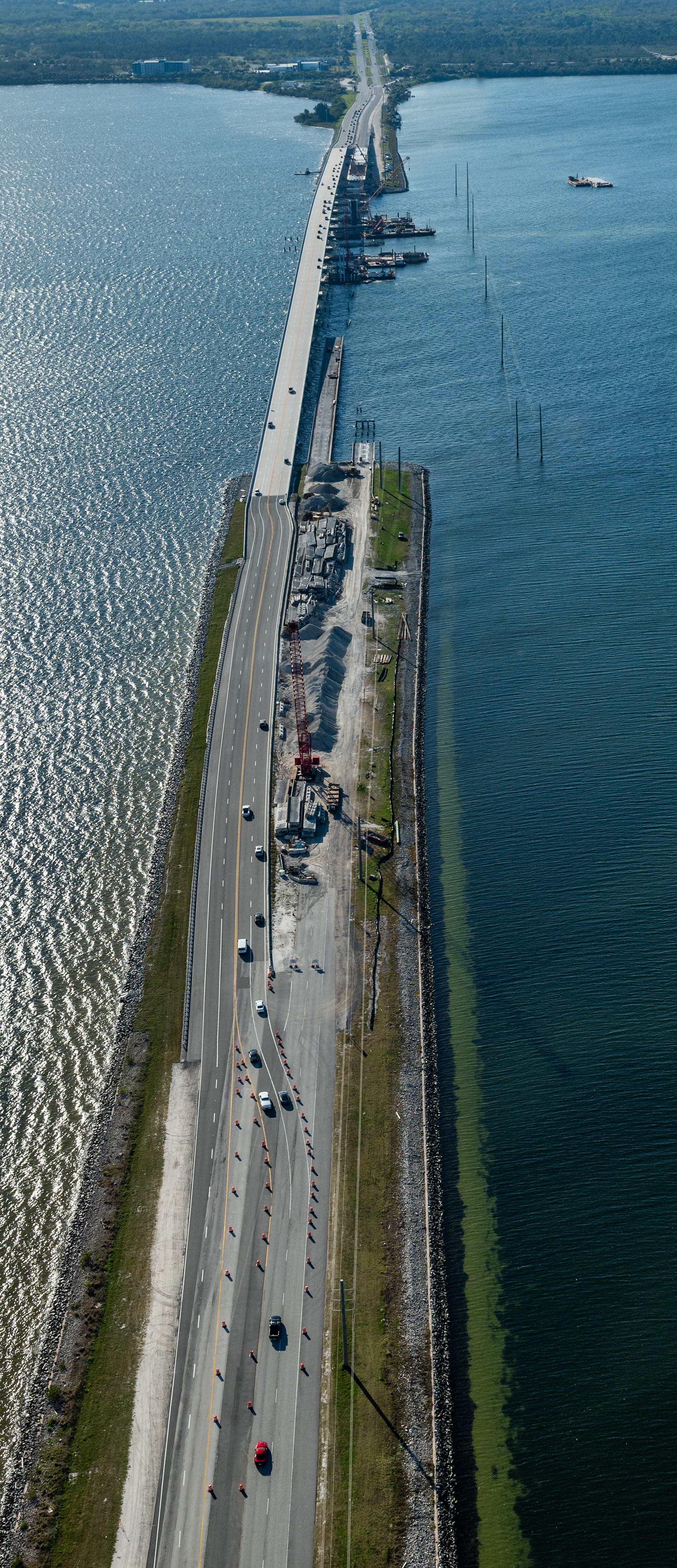 aerial view of partially completed bridge over water