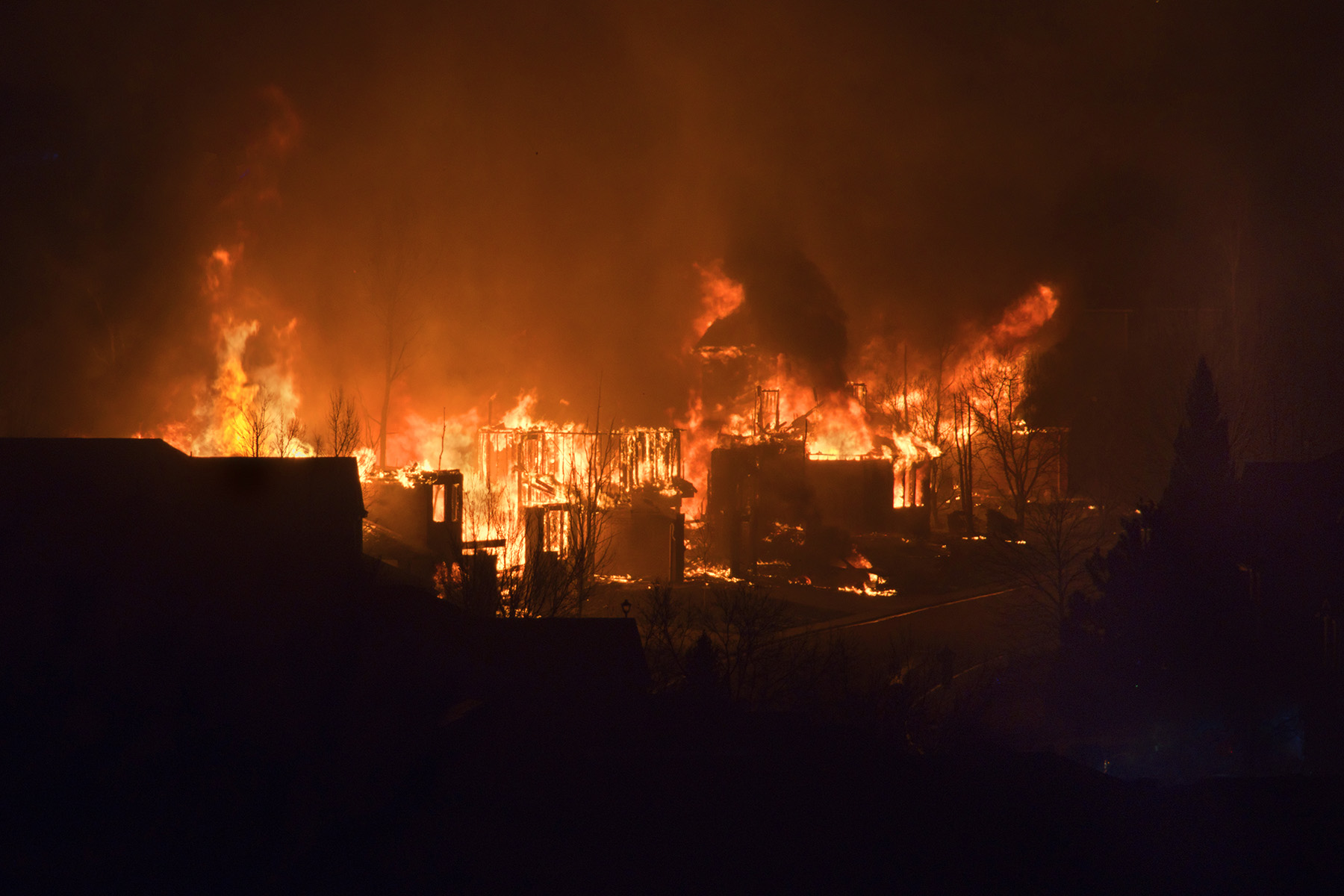 A night-time wildfire is burning up homes.