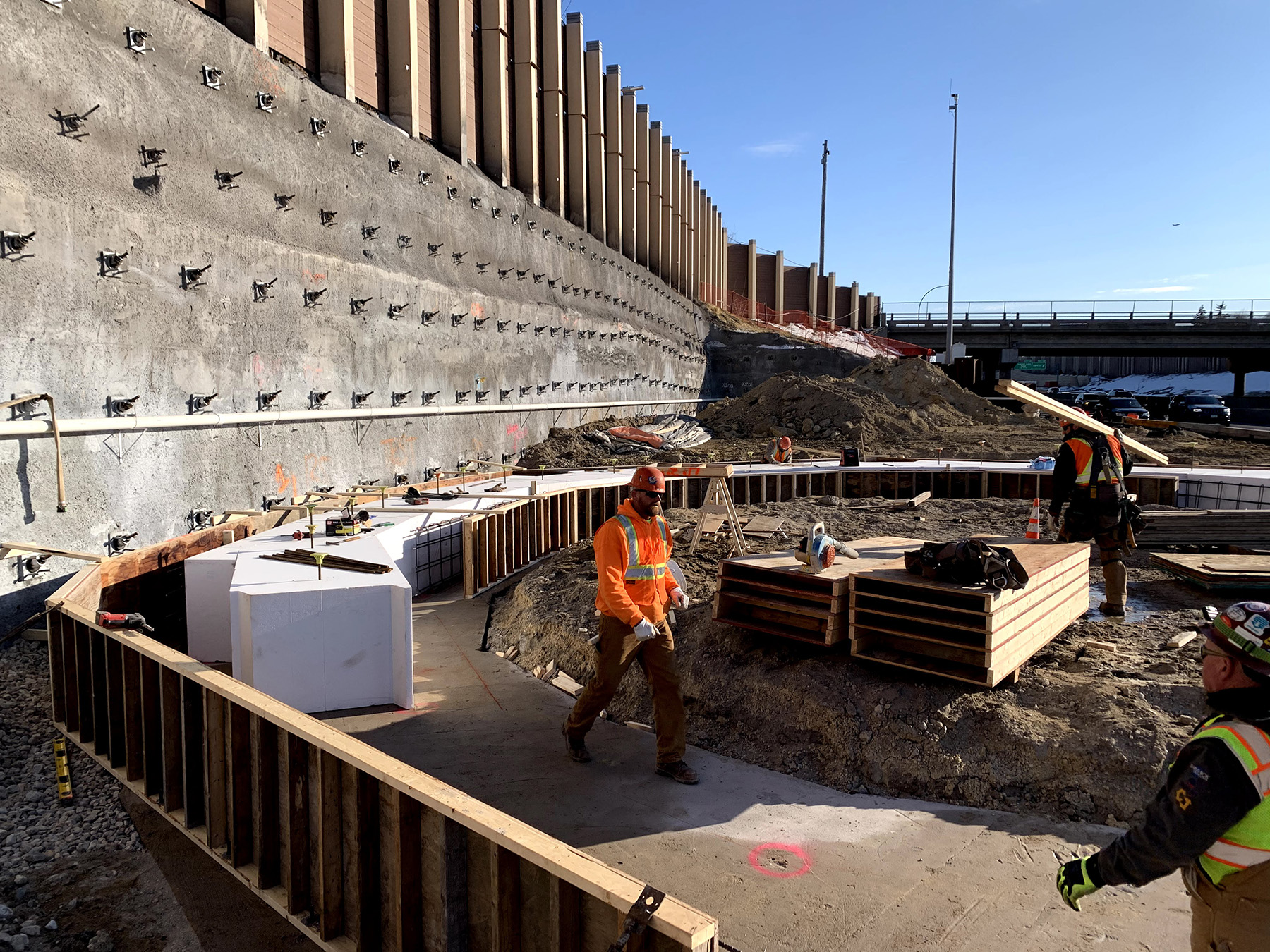 A soil nail wall is being constructed. 