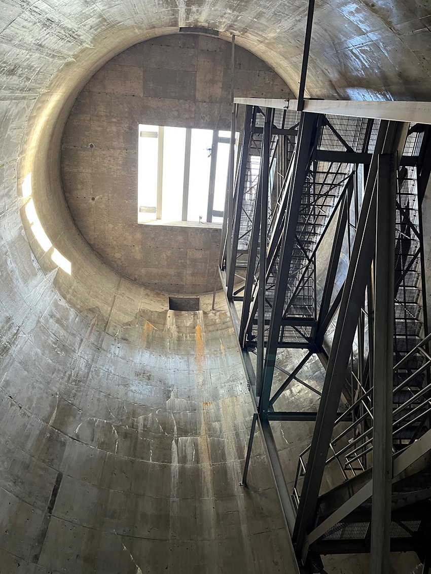 An underground stormwater storage cell is shown. This cell has scaffolding for workers to use for maintenance and repairs. 