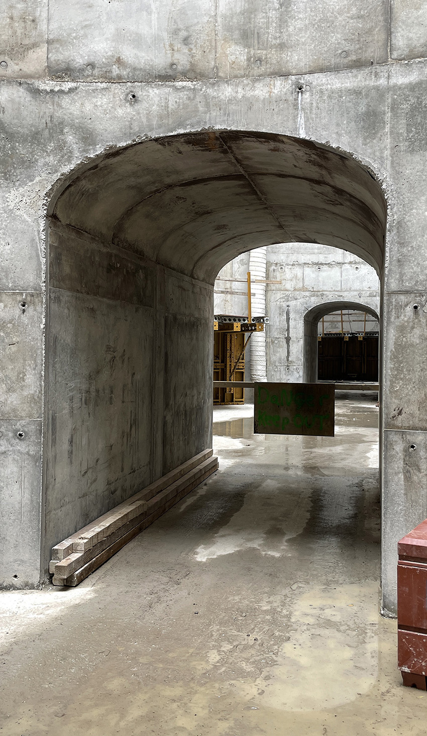 Photo shows the archways and path between interconnected concrete cells. 