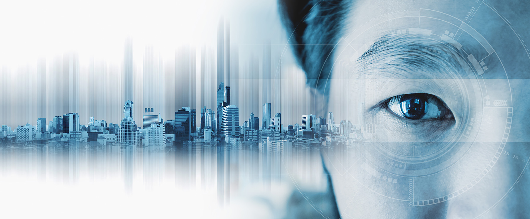 The image shows a close-up of a man’s eye against an urban skyline. 