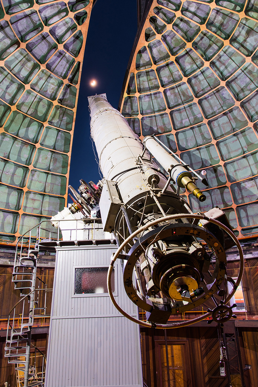 Image shows the Great Refractor telescope within a domed structure at the Lick Observatory. 