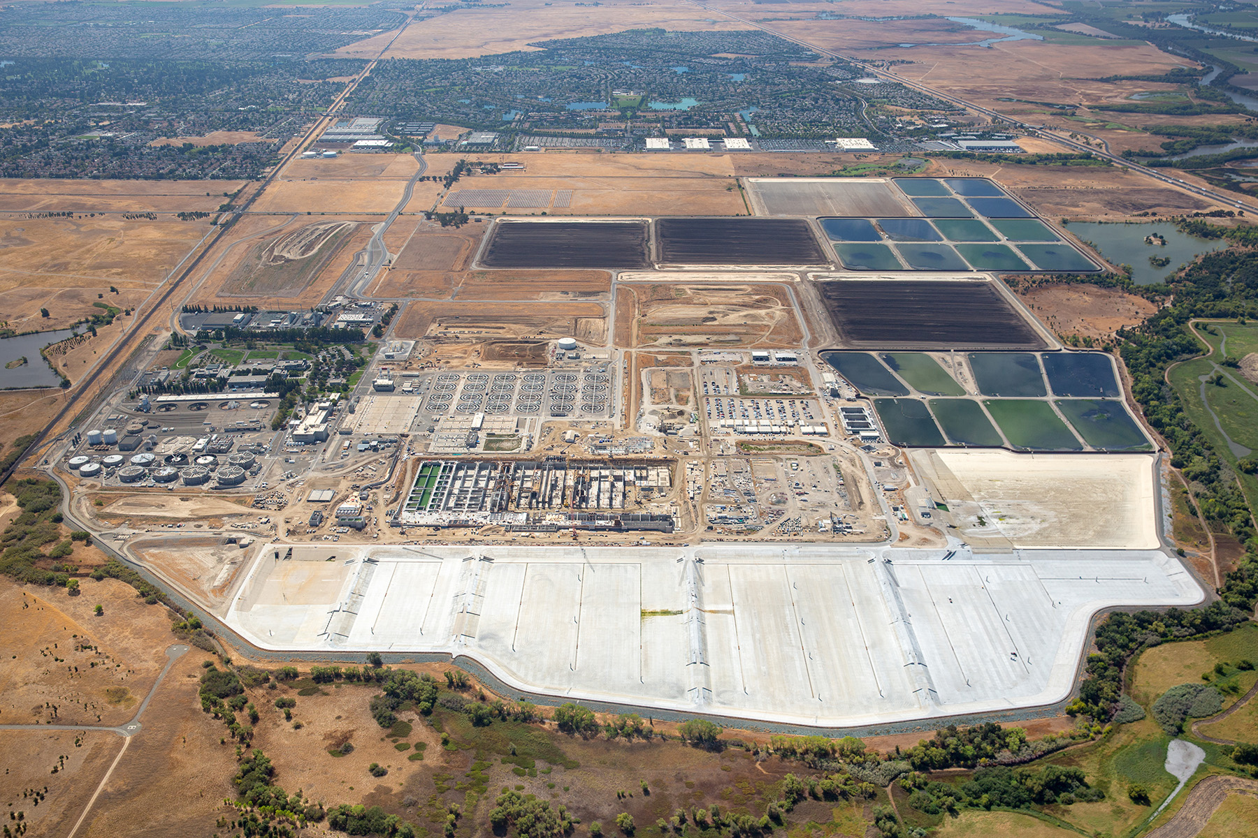 An aerial view of a multi-acre plot of land housing Sacramento Regional County’s wastewater treatment plant. 