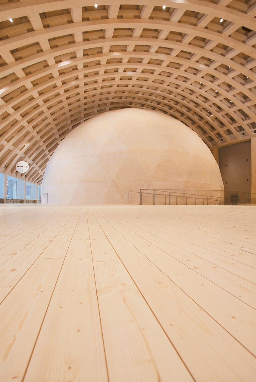 The photo depicts a close-up of the timber roof beams. 