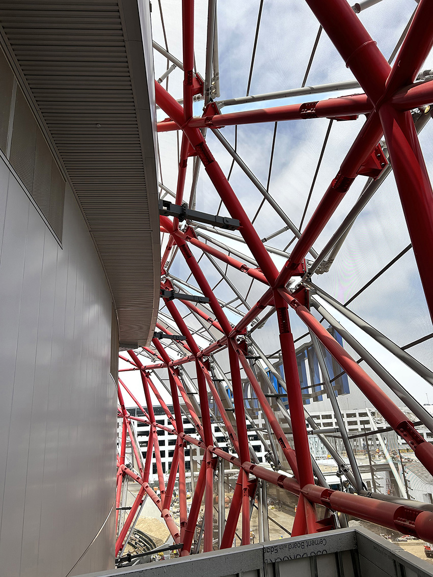 Image shows a closeup of steel toggle braces that connect to the diagrid shell. 