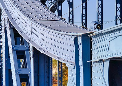 Close-up of a blue iron bridge
