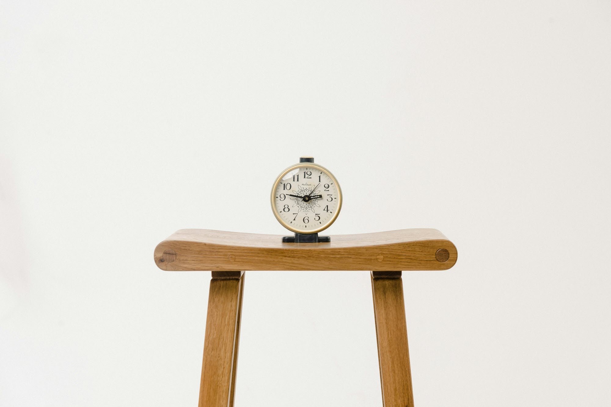 photo of a clock on a stool