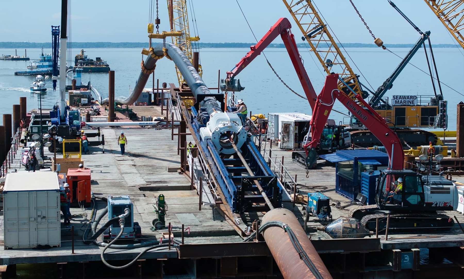 a platform over a body of water with construction equipment a platform over a body of water with construction equipment
