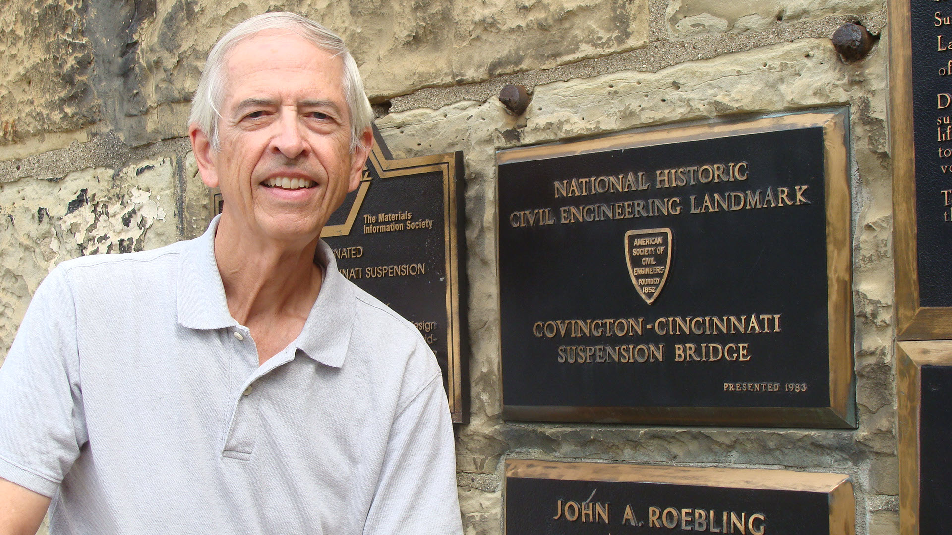 photo of Jonathan Upchurch at a landmark plaque