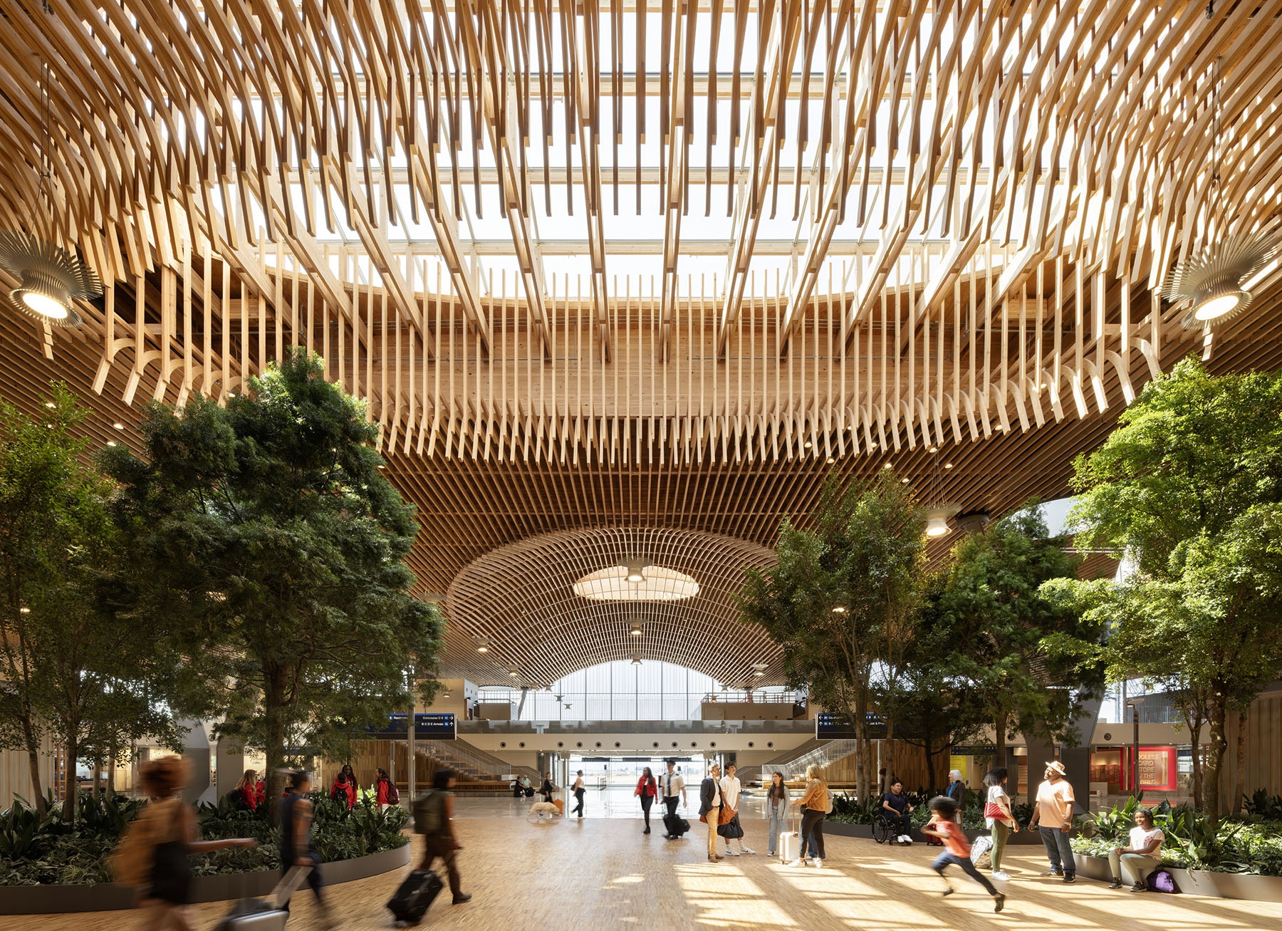 wooden roof covers airport terminated populated with people and trees wooden roof covers airport terminated populated with people and trees