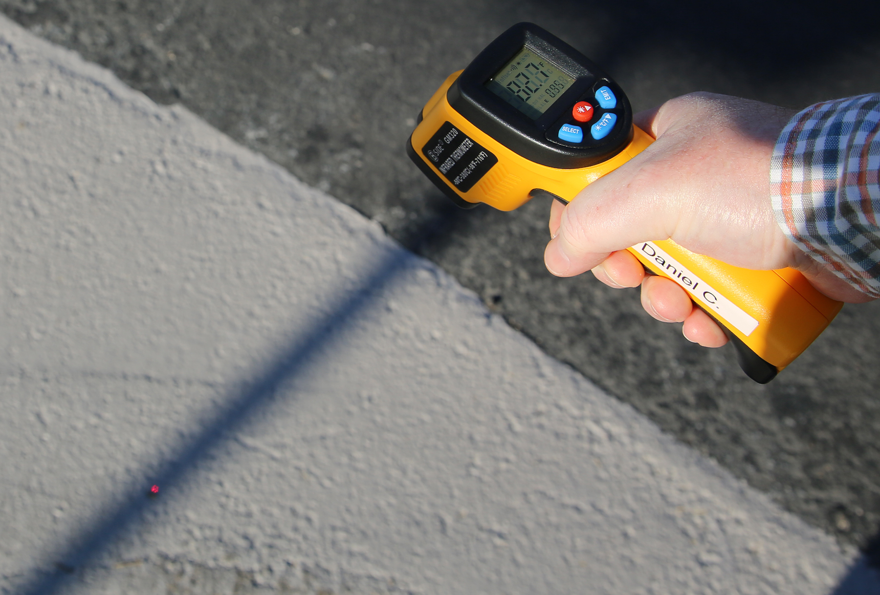 a handheld device takes the street surface temperature