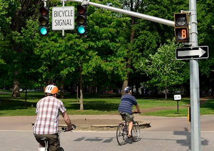 Bicyclists cross a street in a crossing lane